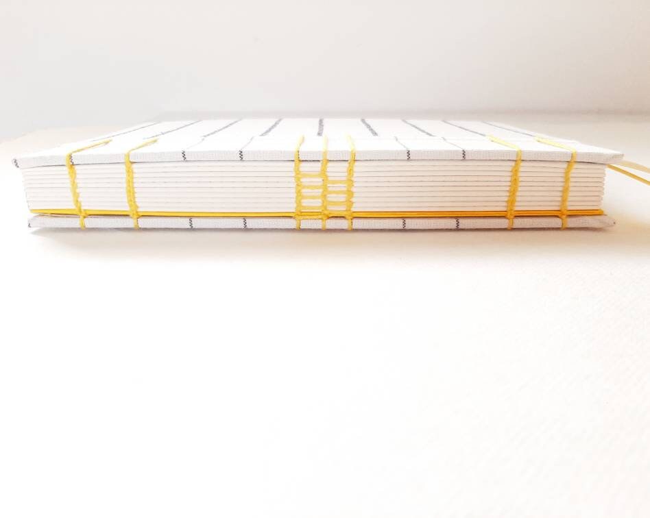 Diario A5 con pagine puntinate e tessuto geometrico nordico