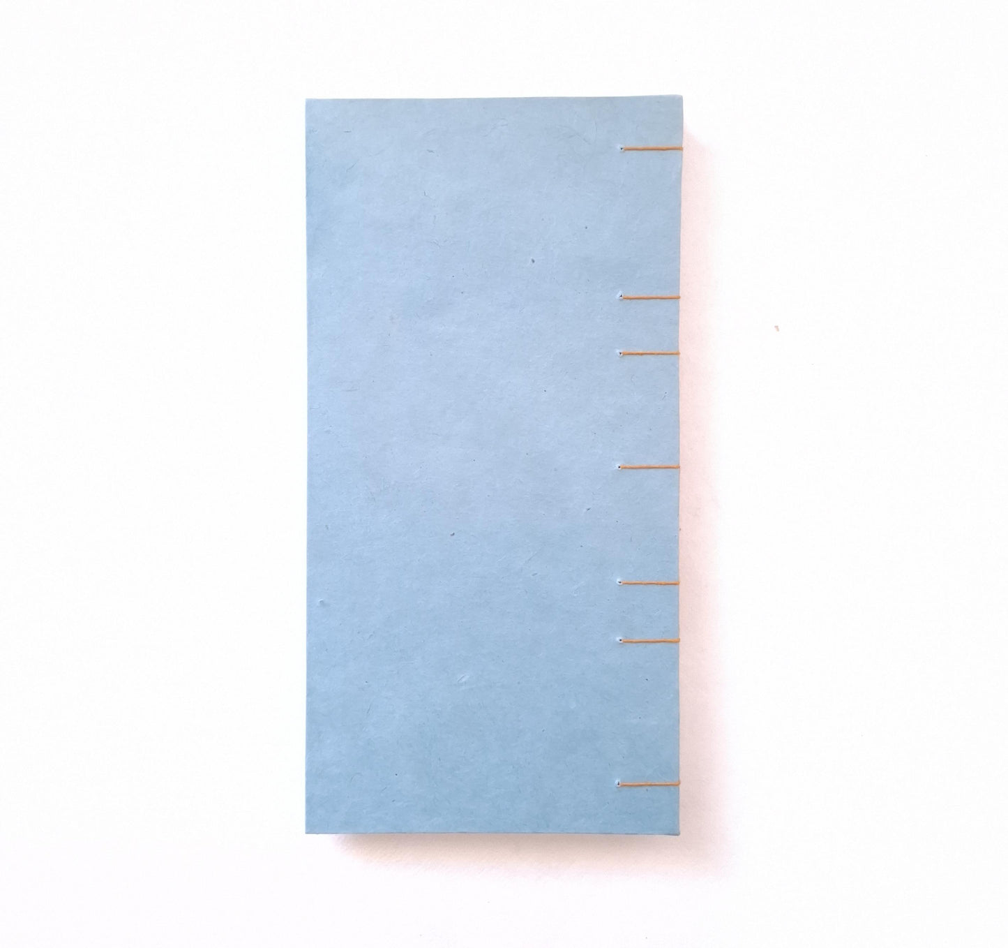Taccuino con pagine avorio e copertine floreali in ocra, oro e verde acqua