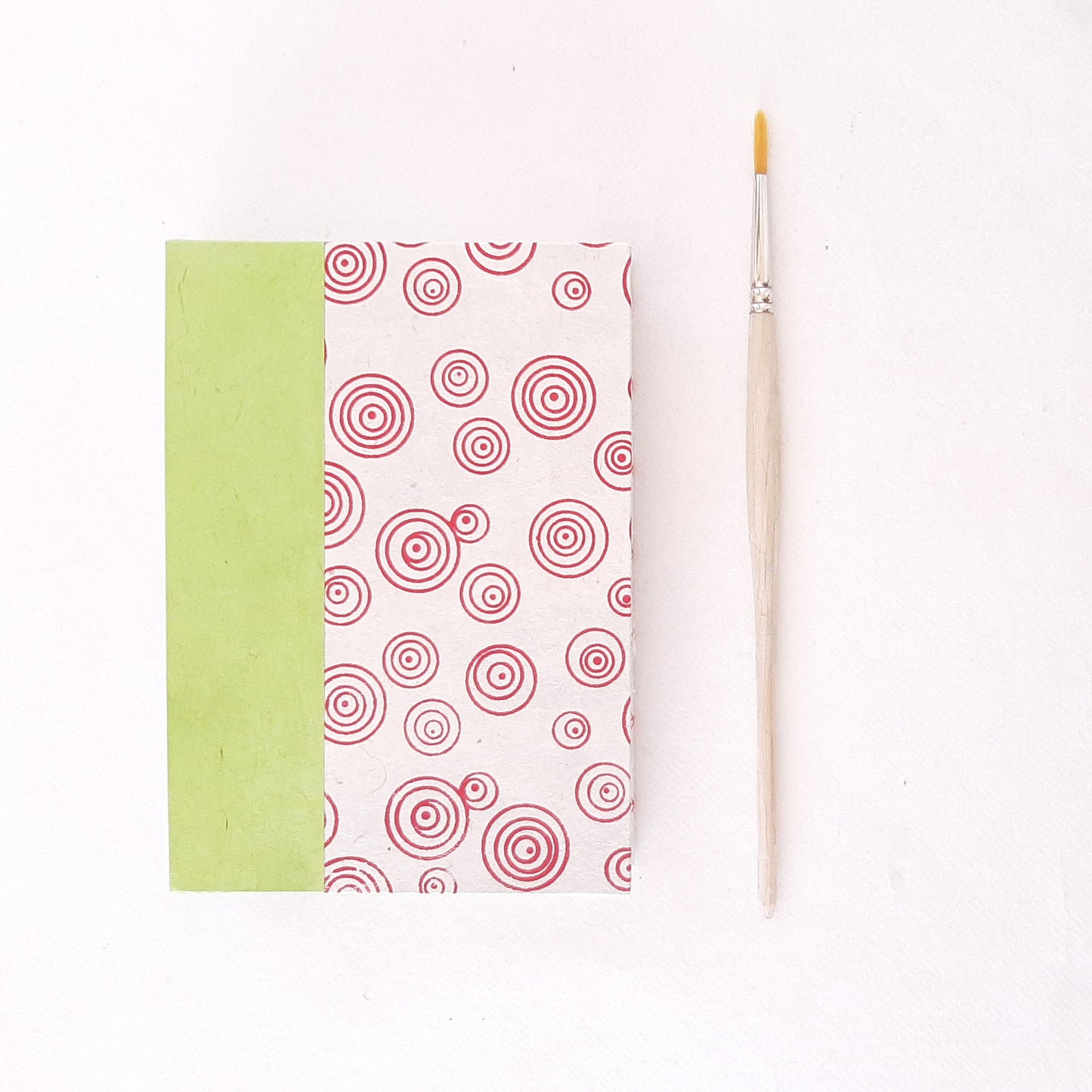 Quaderno tascabile per acquerello con spirali in rosso e verde pera