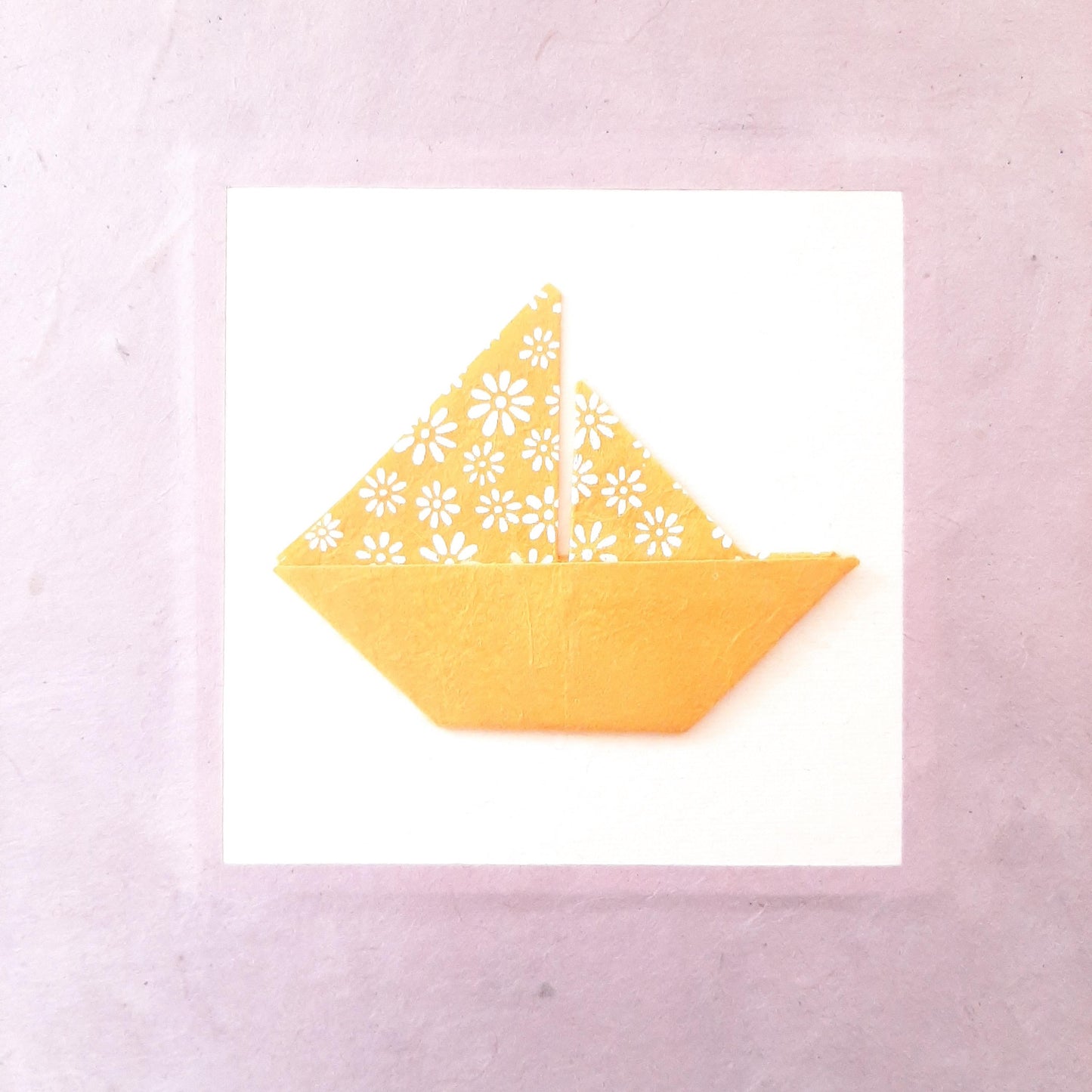Album nascita con barca origami in lilla e miele